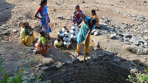 Women drawing water from a village well. Prior to watershed development and integrated water management, scarcity of water was a way of life for the people of Kumbharwadi (Image: WOTR)