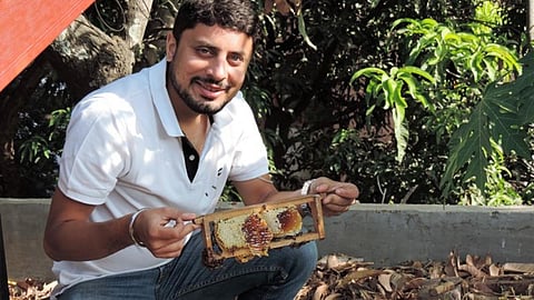 Amit with a bee box installed in a garden at a house in Pune. (Image source: Amit Godse)
