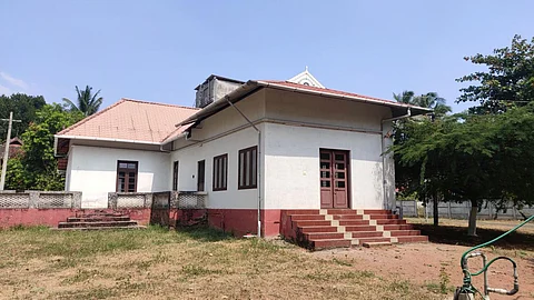 Rainwater is captured from the rooftop of the community hall and diverted to the sump before it is pumped into the open well. (Image by Authors)