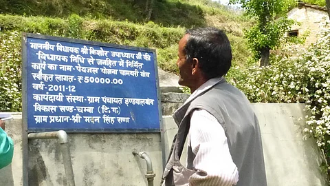 Madan Lal gazes at a water supply scheme