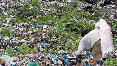 A ragpicker sorts through garbage