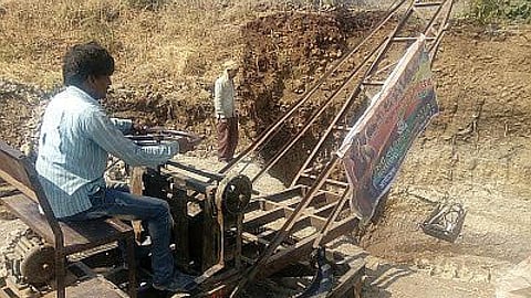 Digging an open well that had some water at lesser depths ranging from 5-10 m using local technology in which a motor run winch draws up the dug up mud from the well bottom. (Image: Rahul Banerjee)