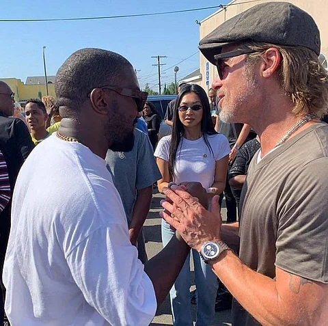 Kanye and Brat at the service