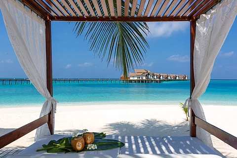 Floating breakfasts, spa sessions and island drums, this Maldives vacation is straight out of a postcard