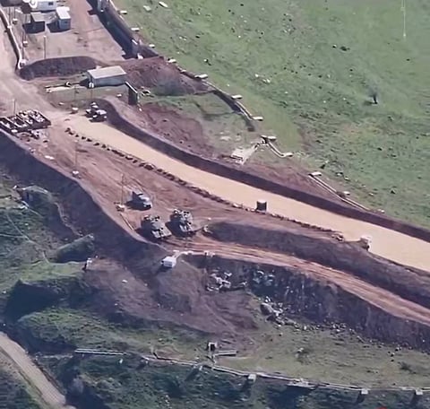 The Israeli military constructing a forward operating base in Syria