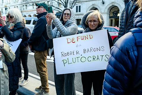 "We Choose to Fight: Nobody Elected Elon" MoveOn protest at the Department of Treasury. February 2025