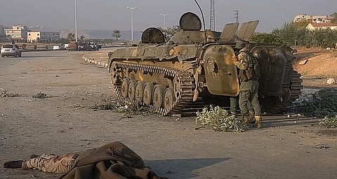 Syrian Arab Army soldiers inspecting a troop carrier