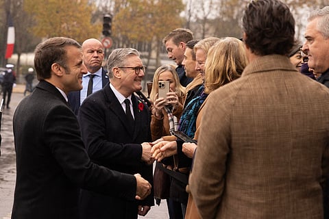 Keir Starmer and Emmanuel Macron pays their respects at the Statues Clemenceau as they commemorate French Armistice Day