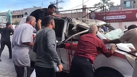 This is a screenshot from Tasnim News Agency footage of an ambulance operated by the Ministry of Health in Khan Yunis, Gaza Strip, after it was heavily damaged by an Israeli military airstrike.