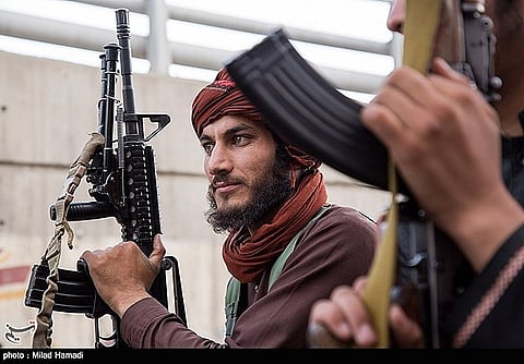 A Taliban fighter wielding an American rifle.