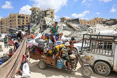 Palestinian refugees forced to flee Hamad quarter in Khan Younis, southern Gaza Strip, after receiving an evacuation warning from the Israeli army, 2024.