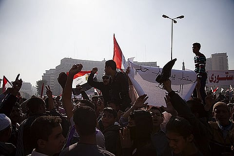 "Protesters in Egypt chant slogans against the Muslim Brotherhood, whose political wing launched Mohamed Morsi to the presidency, November 30, 2012.