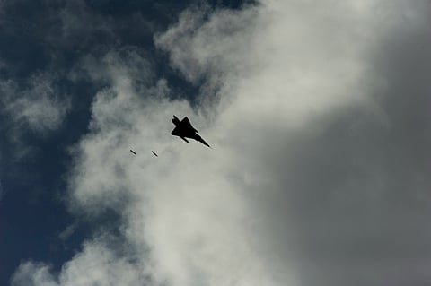 Pakistani Air Force Mirage III drops bombs on a target during Falcon Air Meet 2010