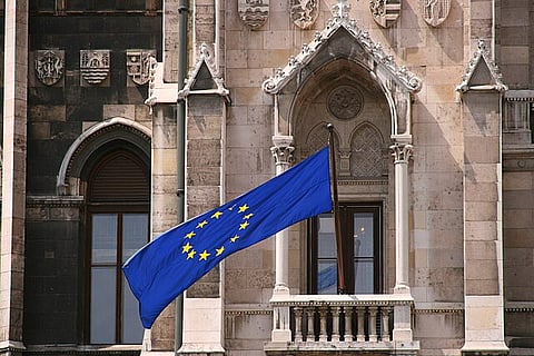 European Union flag at a balcony of the Hungarian Parliament Building in Budapest.
