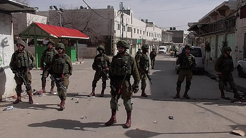 Israeli soldiers blocking street in Hebron, February 2018