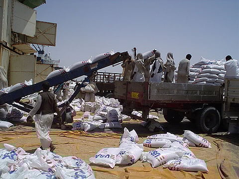 Offloading USAID wheat at Port Sudan for transport to Darfur.