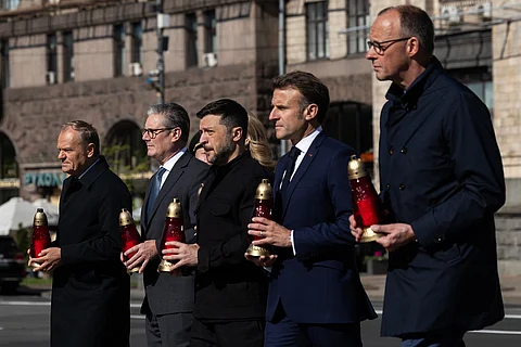Keir Starmer, Emmanuel Macron, Friedrich Merz, Donald Tusk and Volodymyr Zelenskyy, attend a candle ceremony at Maidan Square during a visit to Ukraine