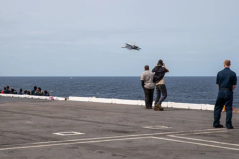 F/A-18 Super Hornet performs a fly-by of USS Gerald R. Ford (CVN 78)