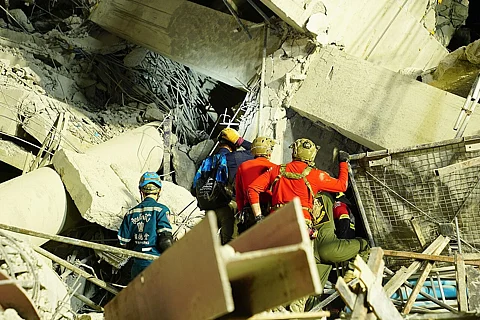 U.S. military personnel work alongside Thai military & first responders near the collapsed State Audit Office March 28, 2025
