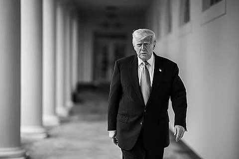 President Donald Trump walks along the West Colonnade on Wednesday, May 21, 2025.