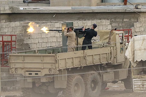Iraqi Army fire a heavy machine at ISIS positions in Mosul March 2017