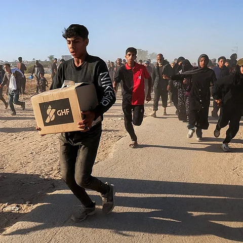 Israel is accused of using starvation as a weapon, with ongoing massacres targeting starving Palestinians at Gaza Humanitarian Foundation aid sites.