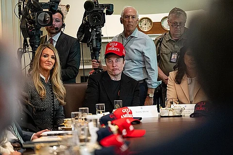 Elon Musk listens to members of the Cabinet as they give updates during a meeting in the Cabinet Room, Wednesday, April 30, 2025.