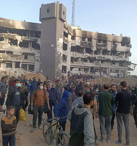 Palestinians gathered around Gaza's al-Shifa Hospital after Israeli forces withdrew.