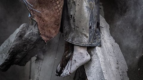 A young girl’s body trapped under rubble in Gaza, from an Israeli airstrike on June 15, 2025.