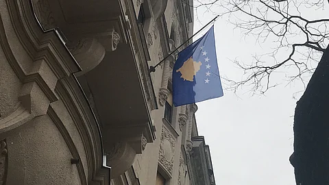 Kosovo flag on a building for illustrative purposes