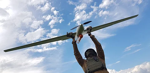 Drone held by Ukrainian soldier