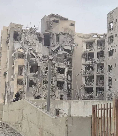 Destruction from an Iranian ballistic missile impact on Be'er Shebaa.
