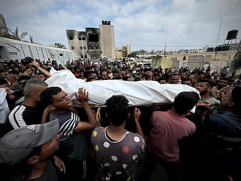 A funeral procession in Gaza, reflecting the ongoing conflict's toll.