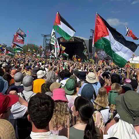 Glastonbury Festival performance by Irish rap group Kneecap on June 28, 2025, where a crowd waved Palestinian flags.