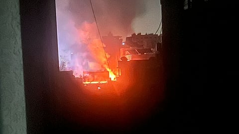 Fire erupts at Mustafa Hafez School, a shelter for displaced families in Gaza City, after an Israeli airstrike.