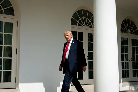 Donald J Trump Walking beside the White House