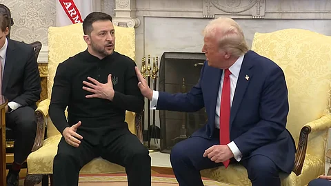 President Trump lightly pushes Ukrainian President Zelenskyy on his shoulder during meeting in Oval Office on Feb. 28, 2025