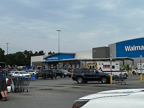 Walmart in Traverse City, Michigan, on July 26, 2025, shortly after a stabbing attack. Multiple ambulances and police vehicles at the scene.