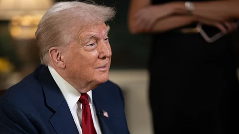 President Donald Trump participates in an interview with Rob Finnerty of Newsmax, Friday, August 1, 2025, in the Diplomatic Reception Room of the White House.