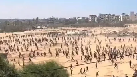 Starving Palestinians seeking aid from airdrops.