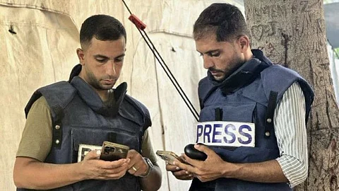 Al Jazeera correspondents Anas al Sharif (Left) and Mohammed Qreiqeh (Right).