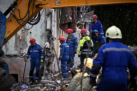 Heavy damage after an Airstrike in Ukraine, emergency workers between the rubble
