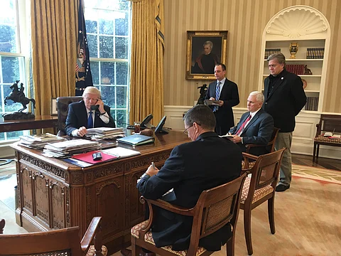 Trump speaking with Putin over the phone in the oval office, January 2017.