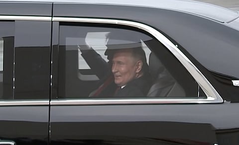 Donald Trump, as President of the United States, rides in his presidential limo with Russian President Vladimir Putin, 15 August 2025.