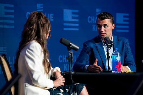 Charlie Kirk sitting with the Director of Homeland Security