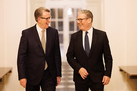 PM Keir Starmer walks with Peter Mandelson, 26 February 2025.