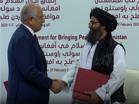 U.S. Envoy Zalmay Khalilzad and Taliban Deputy Leader Abdul Ghani Baradar, Doha, February, 2020.