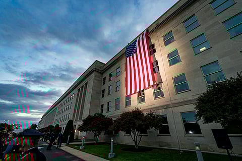 A large American flag is unfurled on the side of the Pentagon in Arlington.
