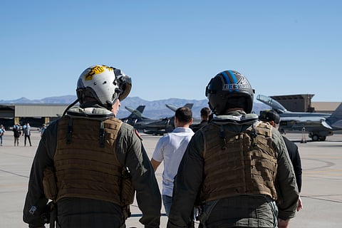 U.S. Secretary of War Pete Hegseth walks out to an FA-18 Super Hornet aircraft at Naval Air Station Fallon, Nev., Oct. 19, 2025