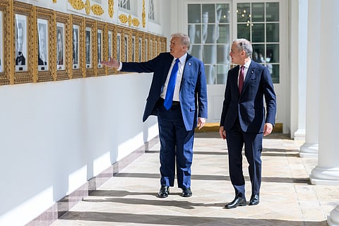 President Donald Trump and Canadian Prime Minister Mark Carney walk on the West Colonnade after their meeting, Tuesday, October 7, 2025.